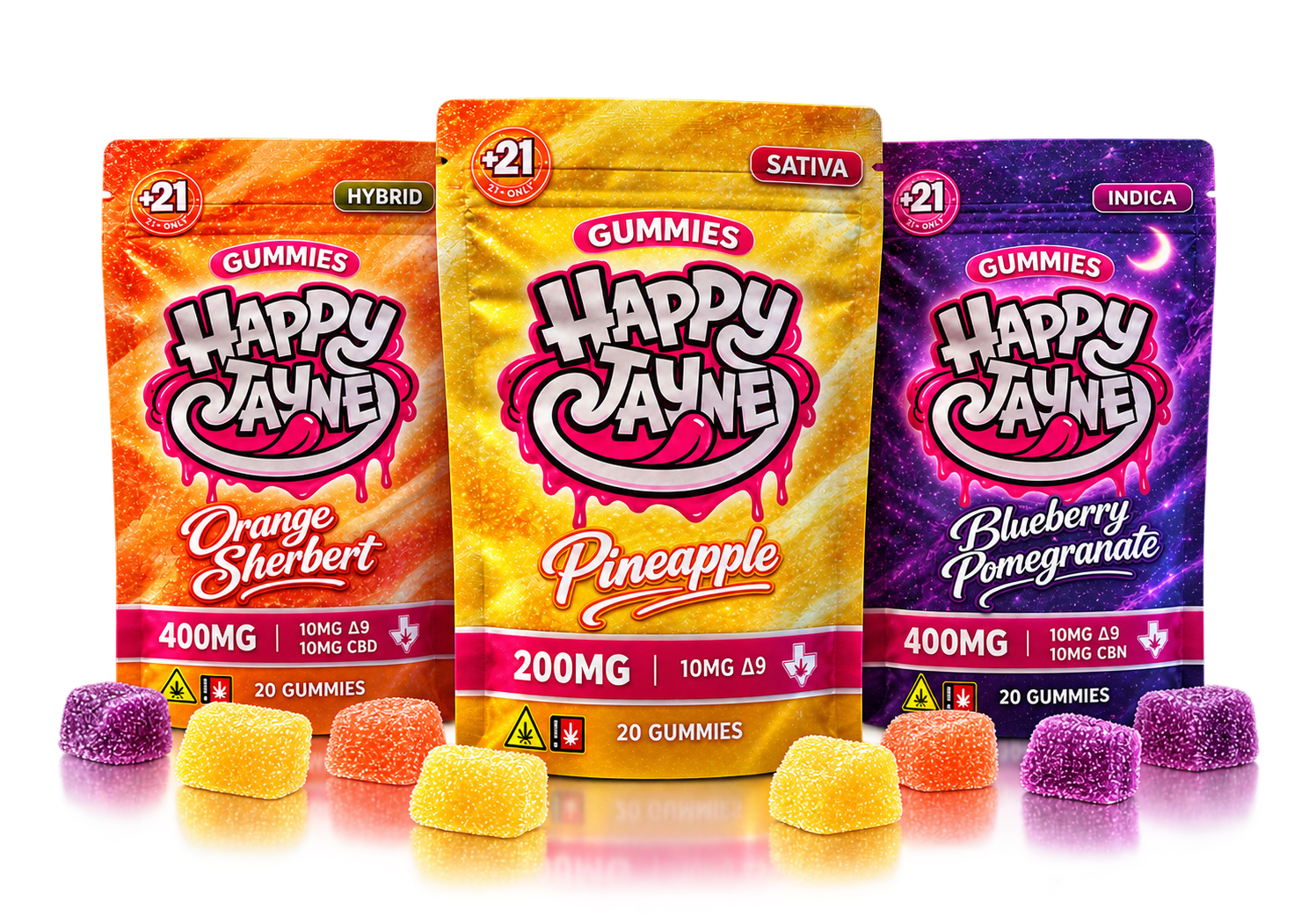 Pineapple, Orange Sherbert, and Blueberry Pomegranate Happy Jayne bags grouped tightly with Pineapple in front, scattered gummies and soft reflections